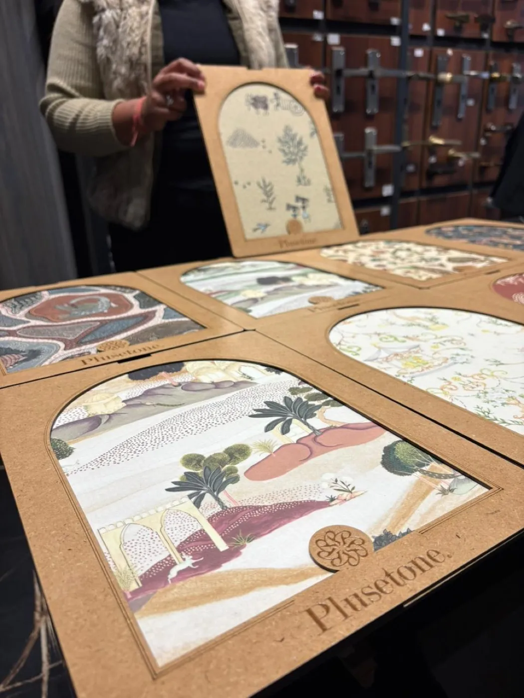 Arch-cut decorative laminate samples in solid colours and wood grains