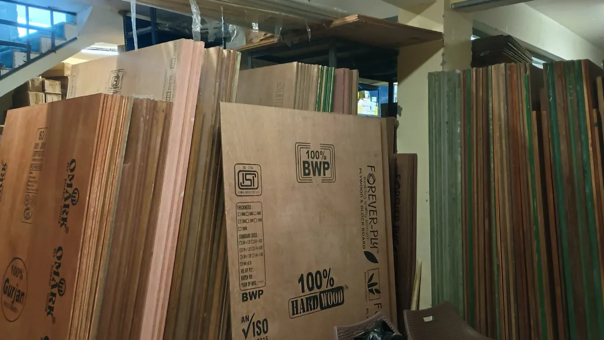 Stacked ISI-marked plywood sheets in the warehouse